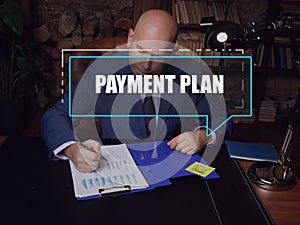 PAYMENT PLAN text in footnote block. Modern Banker checking financial report AÃÂ termÃÂ payment planÃÂ involves receiving equal photo